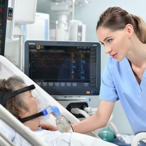 nurse and woman on ventilator