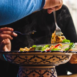 People serving food to each other