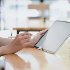 woman looking at tablet