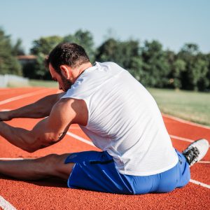 man stretching his hamstrings