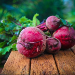 beets and beet greens on a table