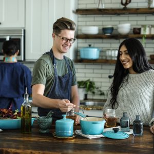 two people cooking in the kitchen