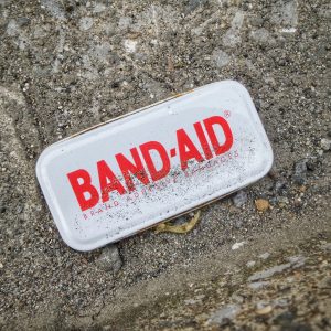 box of bandaids on the ground