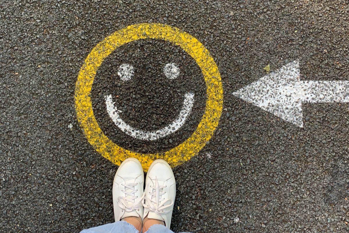 smiley face painted on asphalt