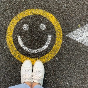 smiley face painted on asphalt