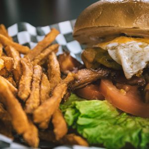 close up photo of a burger and fries