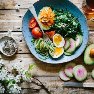 healthy salad in a bowl on a wood table