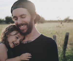 dad and daughter laughing together