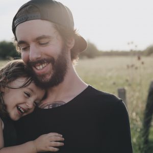 dad and daughter laughing together