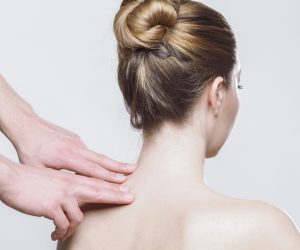 woman getting acupressure on her neck