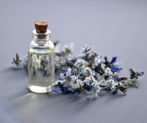 essential oil bottle with a lavender sprig