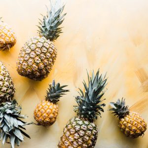 pineapples arranged against a gold surface