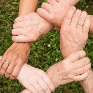 people gripping each other's wrists