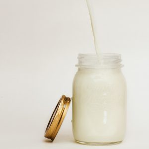 a mason jar full of milk
