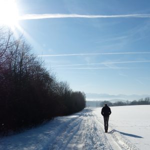 man walking in the snow