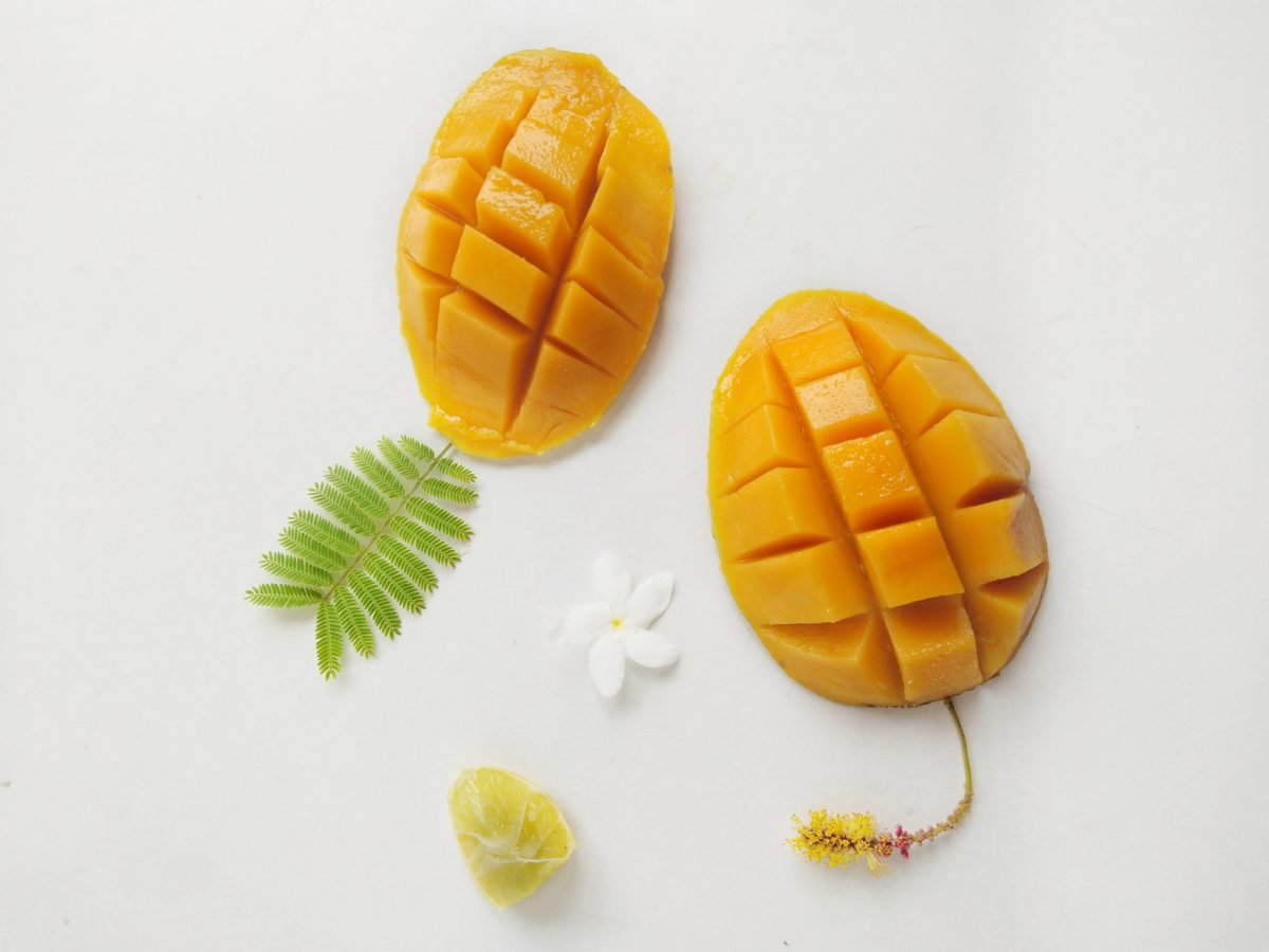 mangoes against a white background