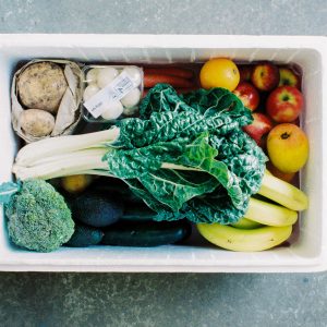 cooler filled with fruits and vegetables